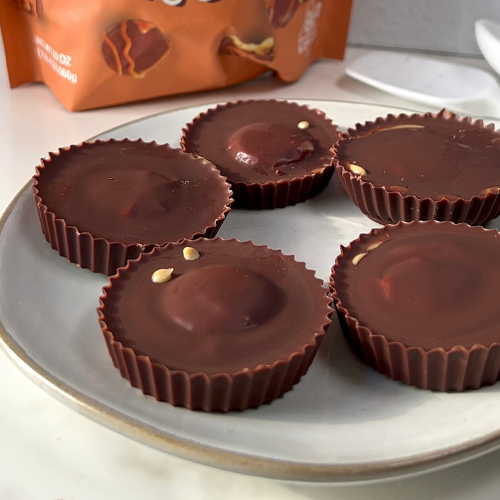 Homemade chocolate peanut butter cups with a cookie bite centre on a plate